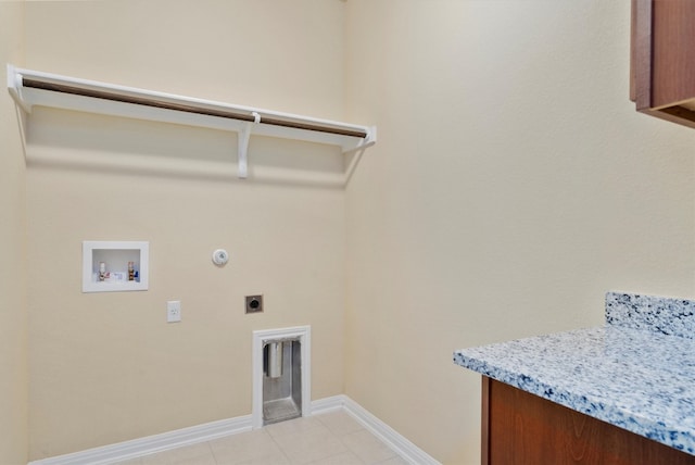 laundry area featuring hookup for an electric dryer, hookup for a gas dryer, light tile patterned floors, and hookup for a washing machine