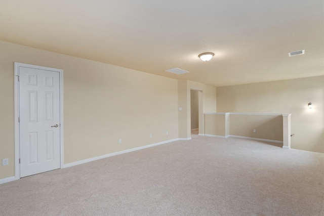 empty room with light colored carpet