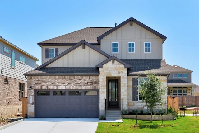 view of front of home with driveway, a shingled roof, board and batten siding, and entry steps