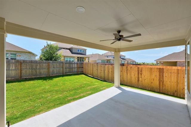 view of yard featuring a ceiling fan, a fenced backyard, and a patio