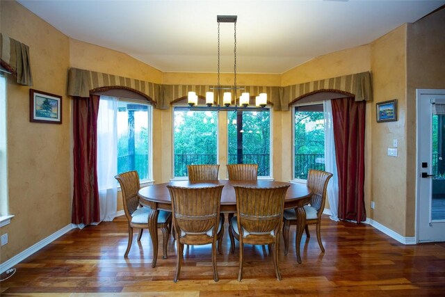 dining space featuring a chandelier and hardwood / wood-style flooring