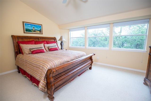 carpeted bedroom featuring lofted ceiling and ceiling fan