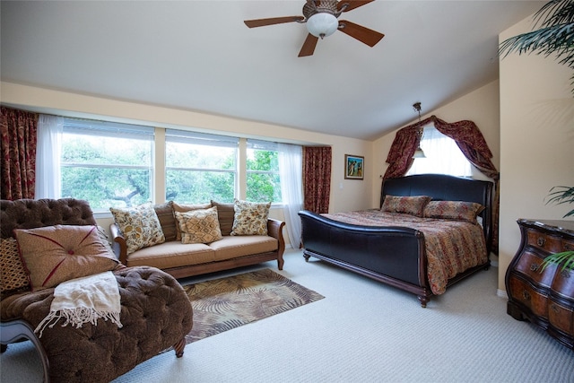 carpeted bedroom with lofted ceiling and ceiling fan