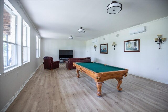 playroom with wood-type flooring, crown molding, an AC wall unit, and billiards