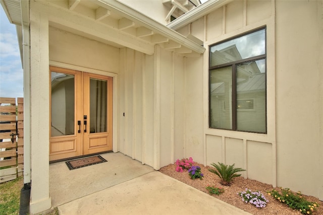 view of exterior entry featuring french doors