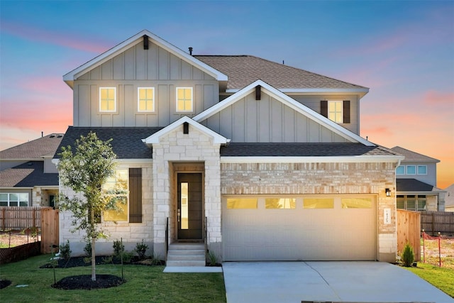 view of front of home with a lawn and a garage