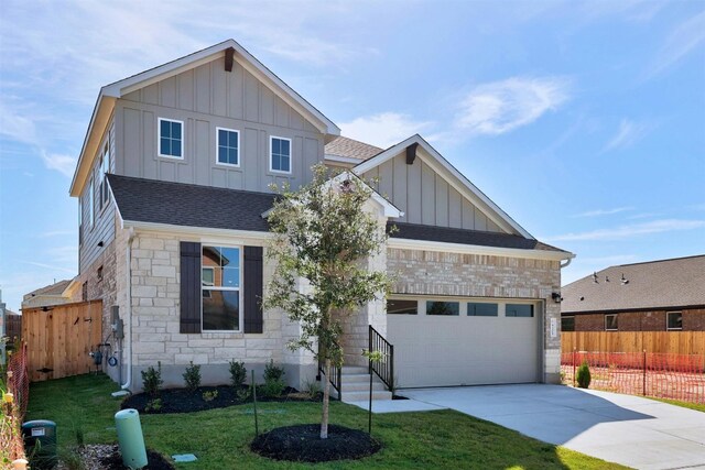 view of front of house with a garage and a front yard