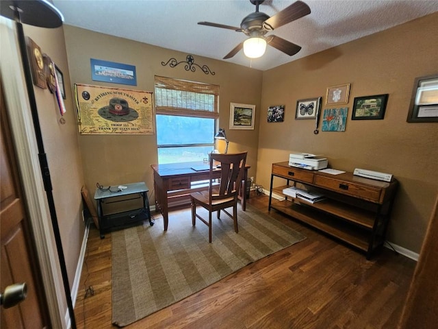 dining space with ceiling fan and dark wood-type flooring