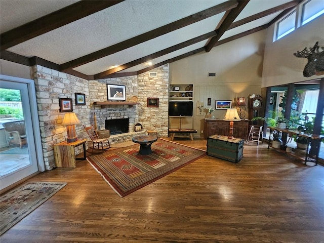 living room with a wealth of natural light, a fireplace, high vaulted ceiling, and dark hardwood / wood-style floors