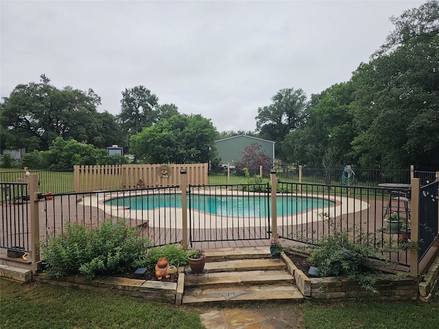 view of swimming pool with a patio area