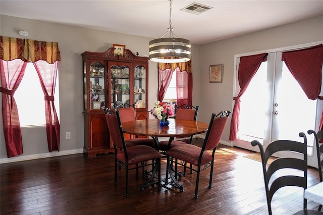 dining room featuring an inviting chandelier and hardwood / wood-style flooring