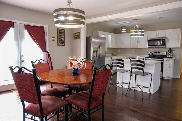 dining space with dark hardwood / wood-style flooring