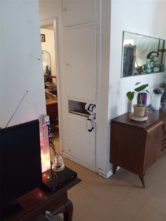 hallway with light tile floors