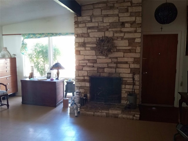 living room with vaulted ceiling with beams, tile floors, and a fireplace