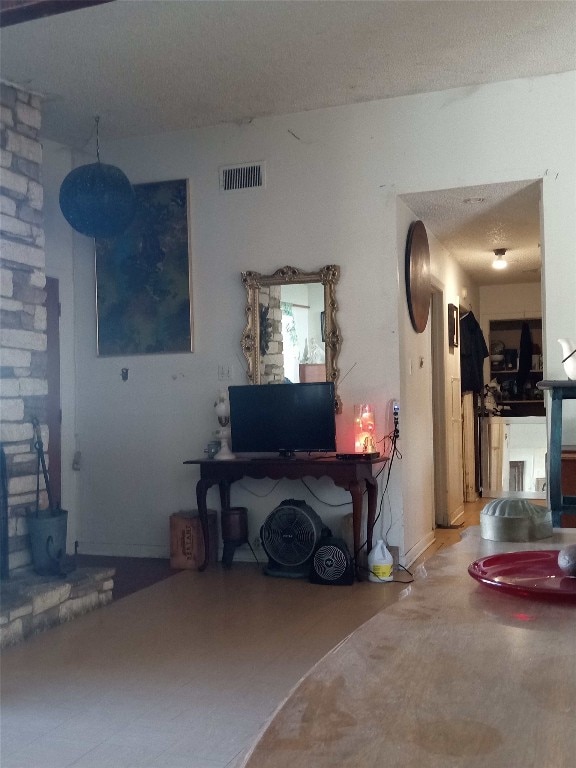 living room with a textured ceiling