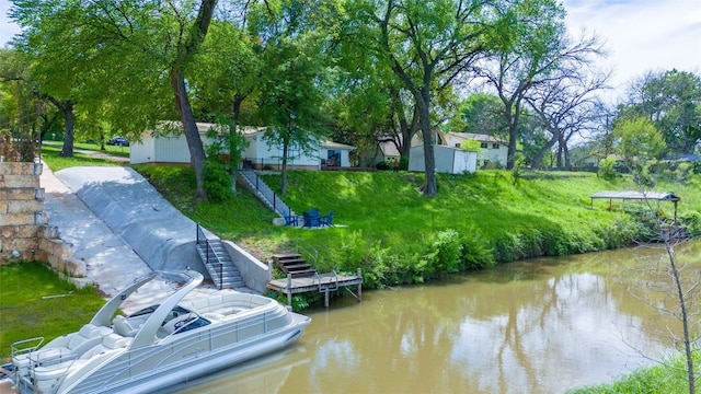 dock area with a yard and a water view