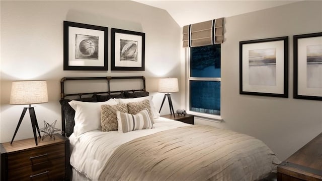 bedroom with dark wood-type flooring and vaulted ceiling