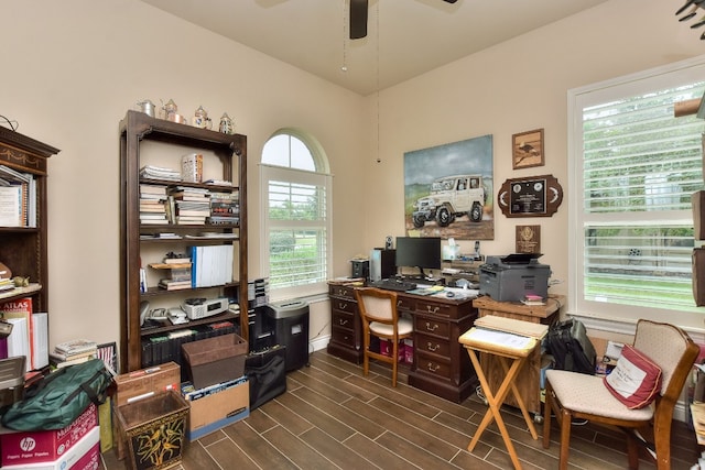 office area featuring dark hardwood / wood-style flooring, ceiling fan, and plenty of natural light