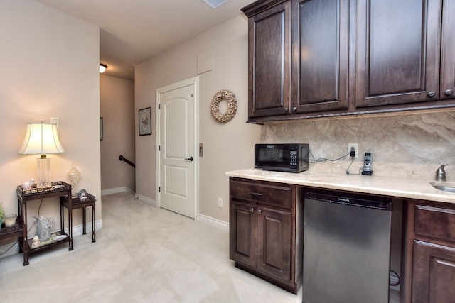 kitchen featuring light colored carpet, sink, dishwasher, tasteful backsplash, and dark brown cabinetry