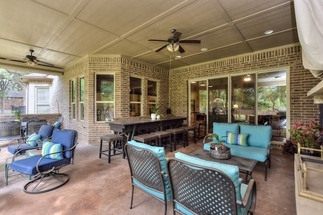 view of patio / terrace with an outdoor living space and ceiling fan