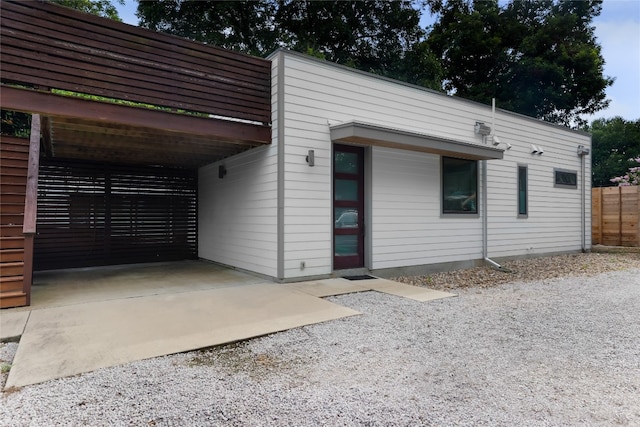 exterior space featuring a carport