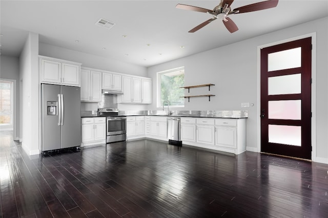 kitchen with ceiling fan, white cabinetry, stainless steel appliances, and dark wood-type flooring