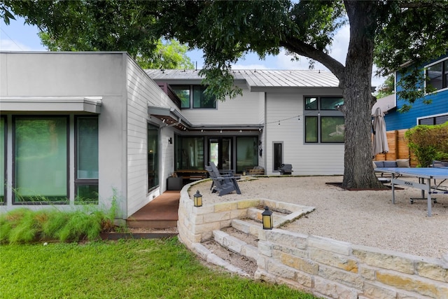 back of house featuring a patio