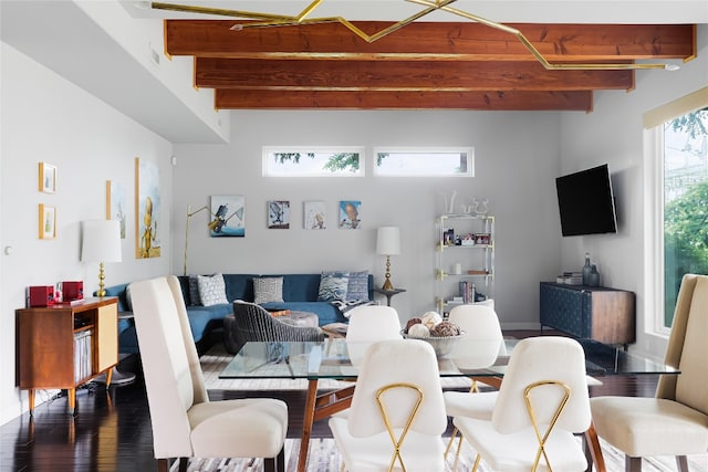 living room featuring beamed ceiling and wood-type flooring