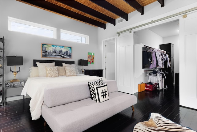 bedroom featuring wood ceiling, beam ceiling, dark wood-type flooring, and multiple windows