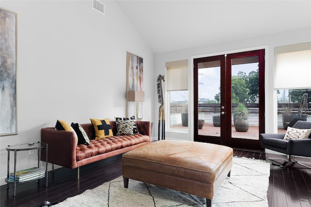 living room with high vaulted ceiling, french doors, and hardwood / wood-style flooring