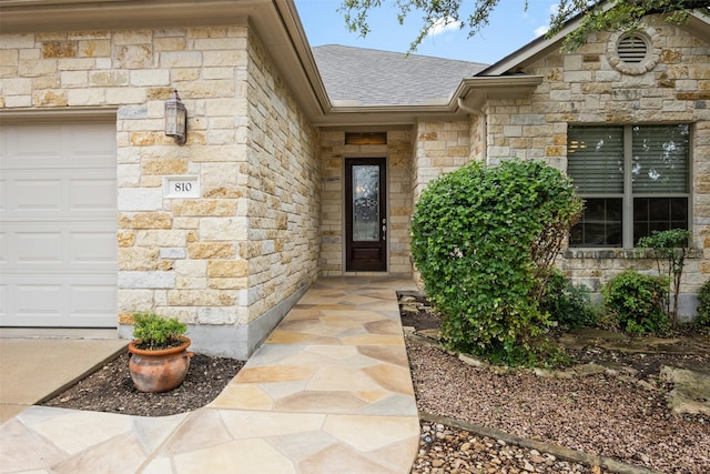 property entrance with a garage