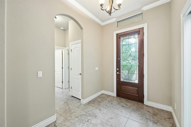 entryway featuring an inviting chandelier and crown molding