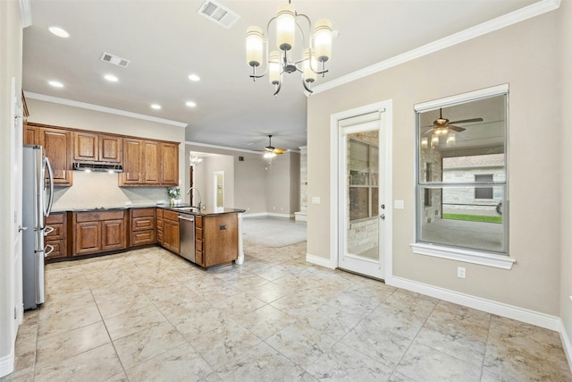 kitchen featuring pendant lighting, ceiling fan with notable chandelier, sink, appliances with stainless steel finishes, and kitchen peninsula