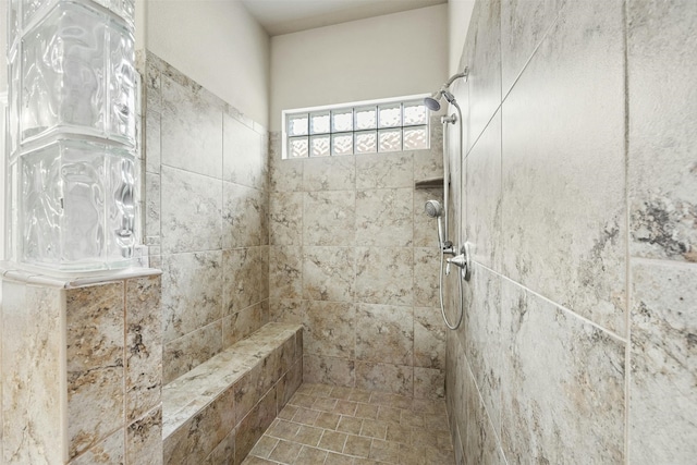 bathroom with tiled shower