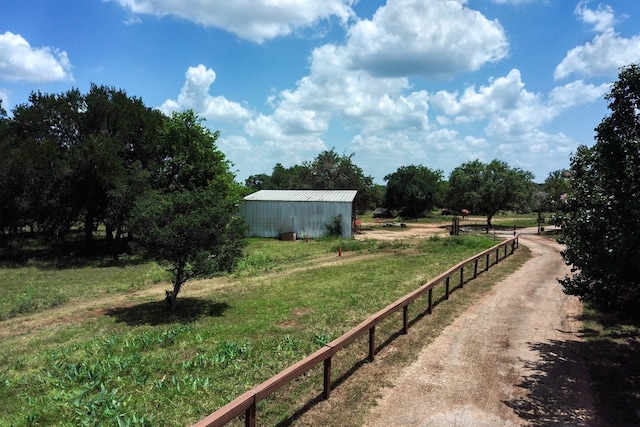 view of yard with a rural view