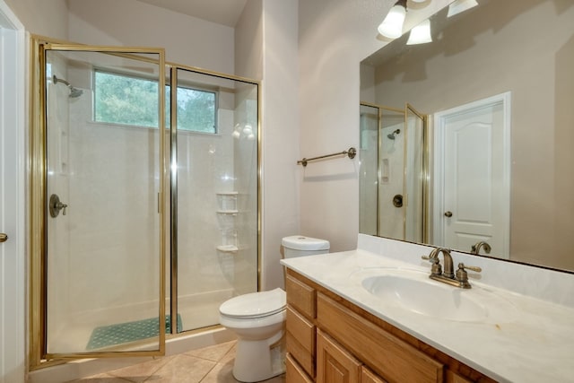 bathroom with tile flooring, vanity, an enclosed shower, and toilet