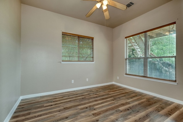 empty room featuring wood-type flooring and ceiling fan