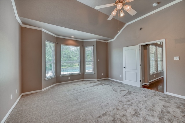 carpeted empty room featuring ornamental molding, ceiling fan, and lofted ceiling