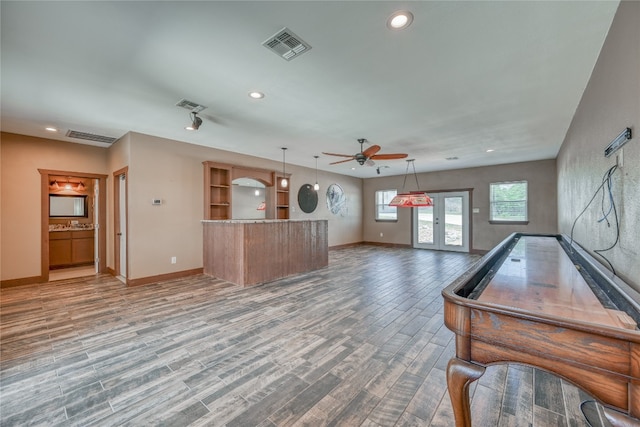 interior space featuring ceiling fan and hardwood / wood-style floors