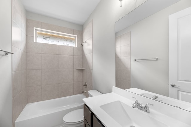 full bathroom with vanity, toilet, and tiled shower / bath combo