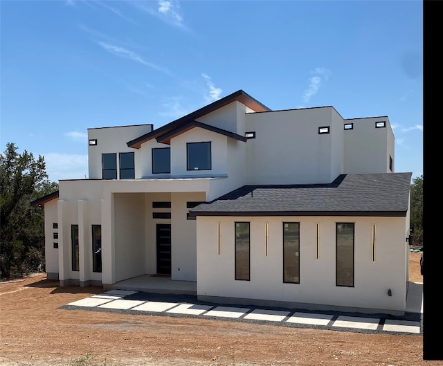 rear view of property featuring a patio area