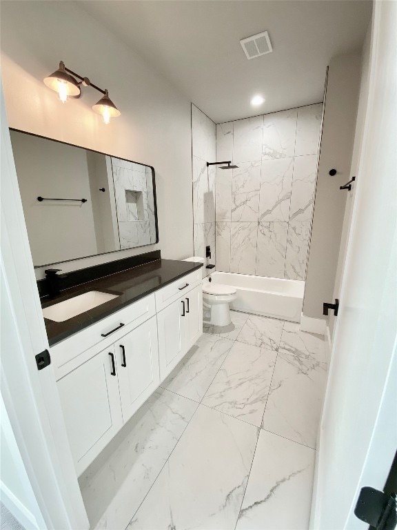 full bathroom with tiled shower / bath, toilet, tile flooring, and vanity