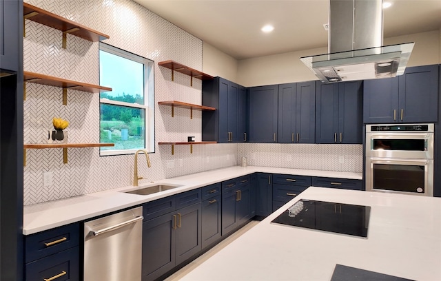 kitchen with appliances with stainless steel finishes, sink, tasteful backsplash, blue cabinetry, and island range hood