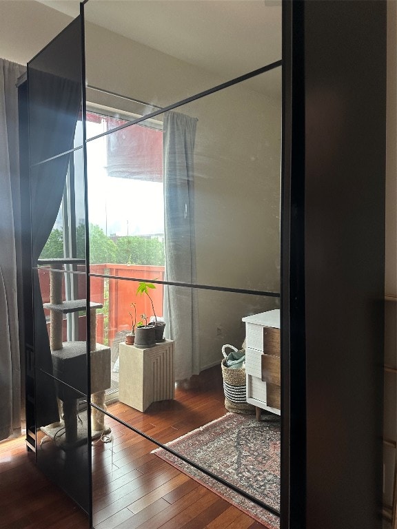 bathroom with a shower with curtain and hardwood / wood-style flooring