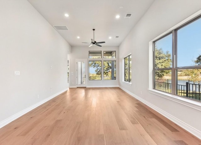226 Flora Springs Cv, Liberty Hill, TX 78642 - unfurnished living room with ceiling fan, light wood-type flooring, baseboards, and recessed lighting