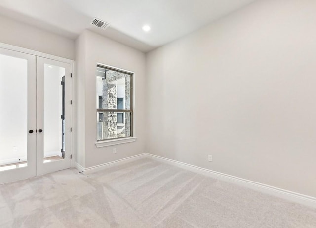 226 Flora Springs Cv, Liberty Hill, TX 78642 - unfurnished bedroom featuring french doors, carpet floors, baseboards, and recessed lighting