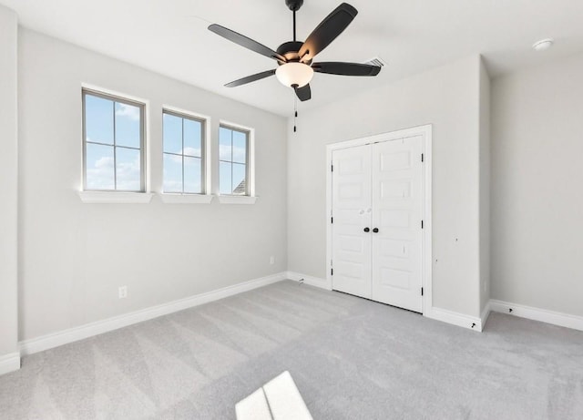 226 Flora Springs Cv, Liberty Hill, TX 78642 - unfurnished bedroom with carpet, baseboards, a closet, and ceiling fan