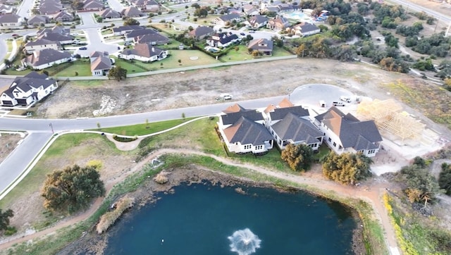 226 Flora Springs Cv, Liberty Hill, TX 78642 - aerial view of property's location with nearby suburban area and a large body of water