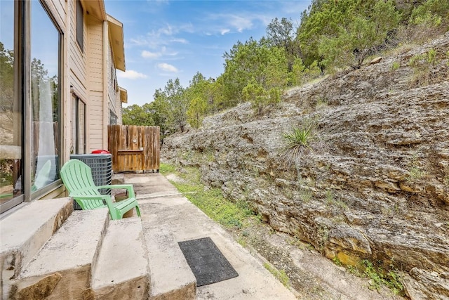 21461 Coyote Trl Unit 6, Lago Vista, TX 78645 - view of yard with central air condition unit and a patio