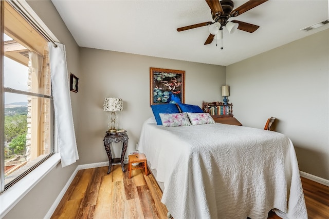 bedroom featuring ceiling fan and hardwood / wood-style flooring